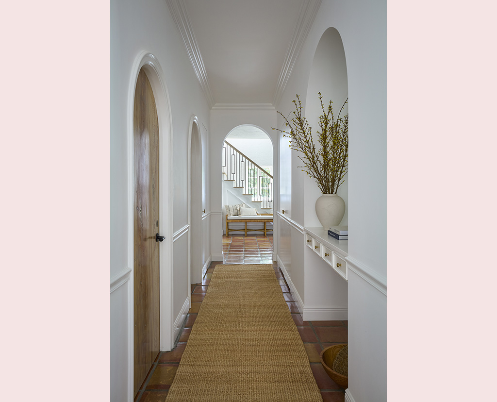 hallway with staircase in back