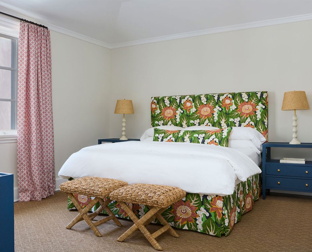 Cozy bungalow bedroom with floral headboard.