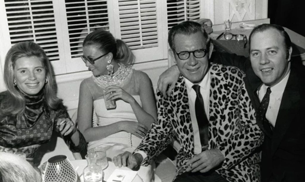 historic photo of two couples enjoying cocktails
