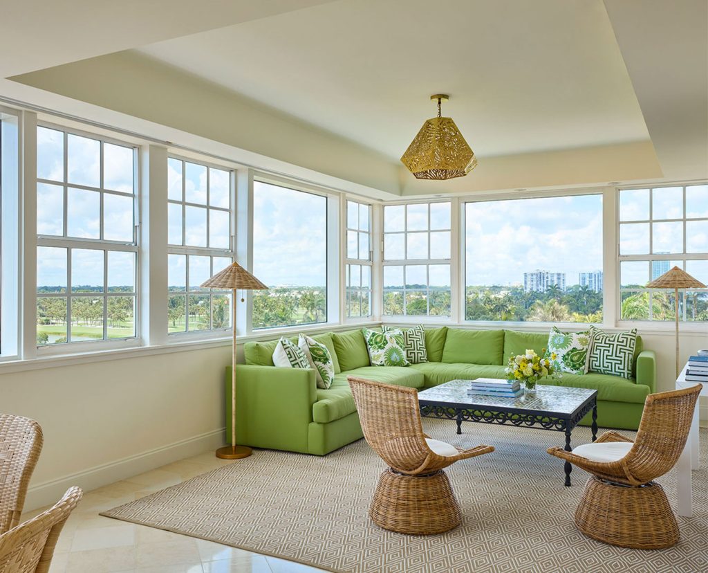Penthouse living room area with view of ocean.