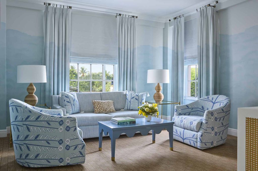 living room suite with sofa and two armchairs, coffee table and two lamps.