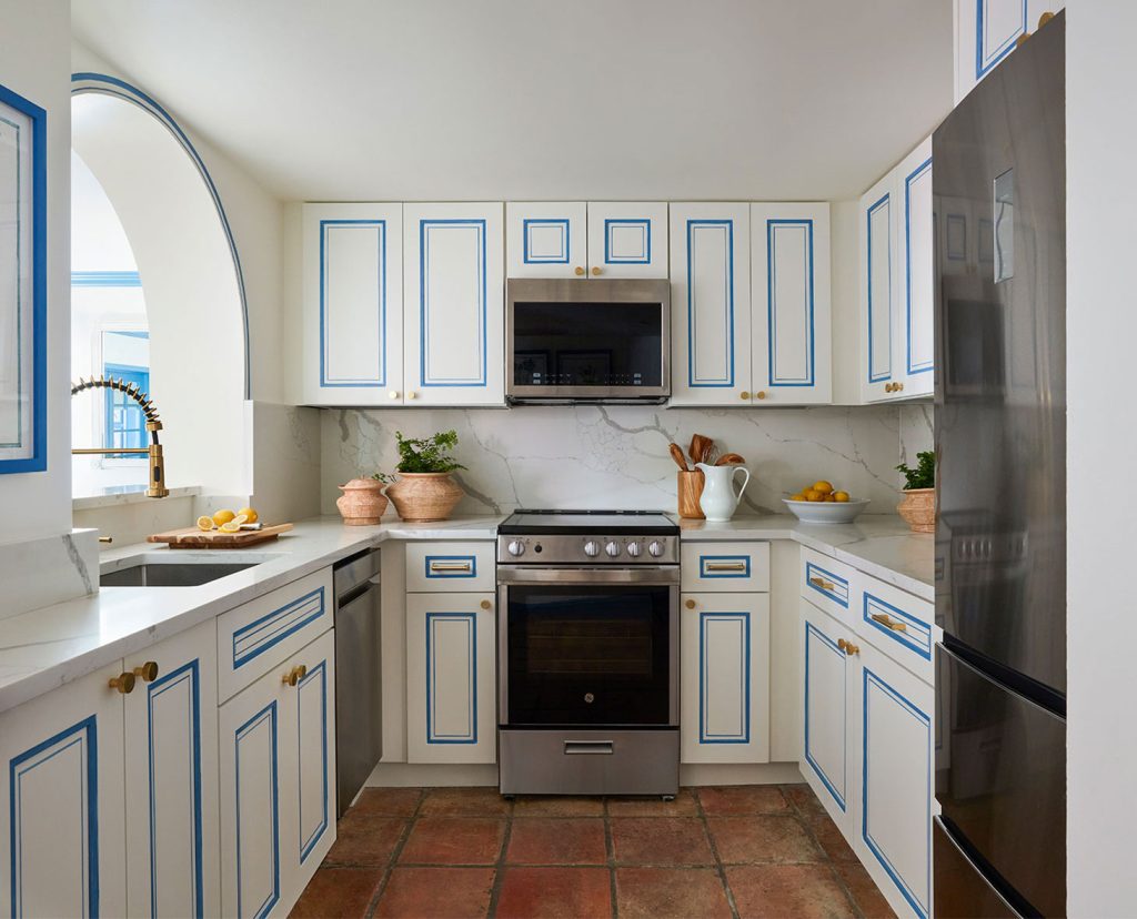 Cozy white kitchen with blue accents.