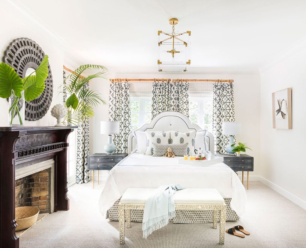 Light and airy bedroom with fireplace.