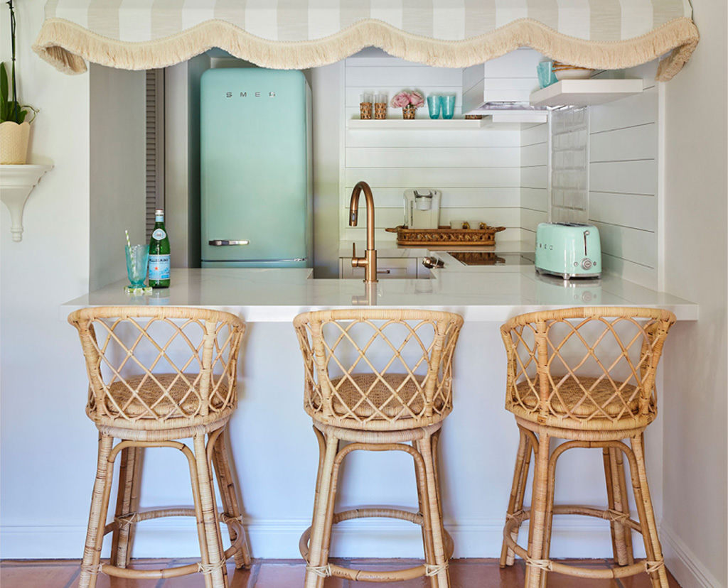 kitchen counter with three stools
